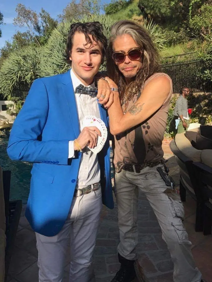 Roby Sobieski performing close-up magic for Steven Tyler