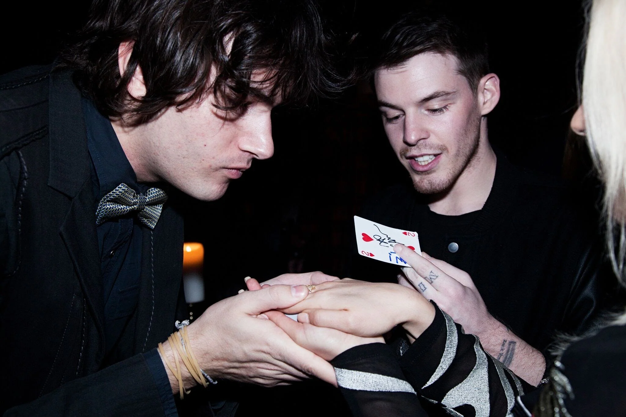 Roby Sobieski performing close-up magic inches from guests at an elegant evening event